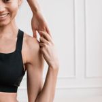 Portrait of Zoryana Klymchuk, a yoga practitioner from Lviv, smiling warmly.